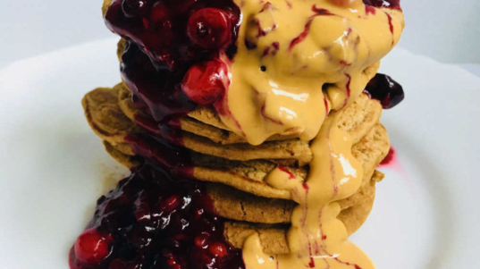 simple vegan protein pancakes with peanut butter and berries
